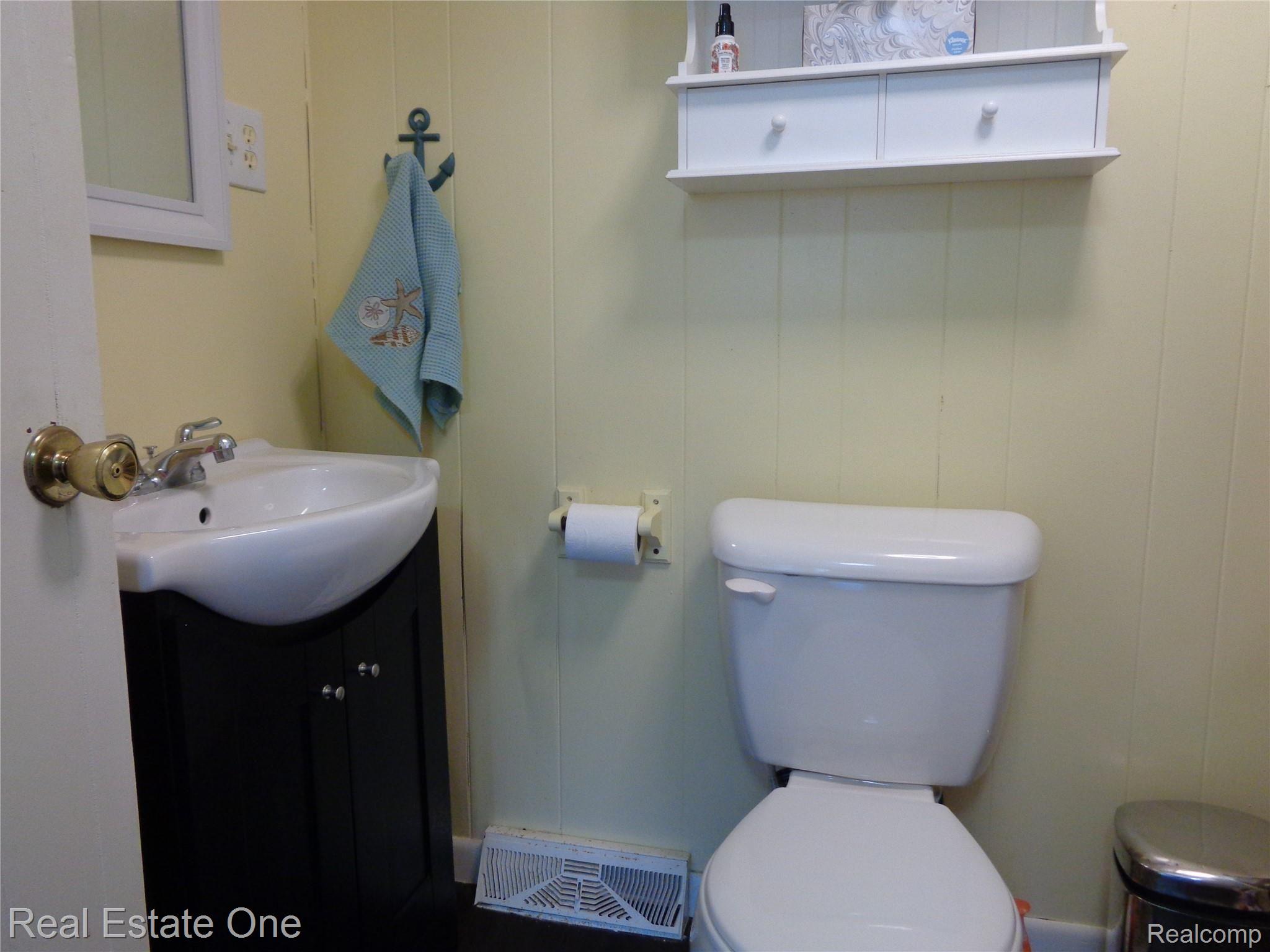 3865 Hunt Road Lapeer, MI 48446 - Photo 35 of 53 Main floor powder room with updated vanity