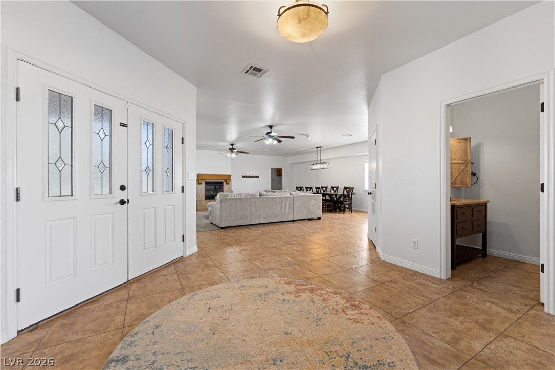 575 Gann Avenue Logandale, NV 89021 - Photo 8 of 75 Step inside this inviting home, featuring an open layout and durable tile flooring throughout the entry.