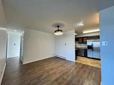 a view of a kitchen with a sink and a large window