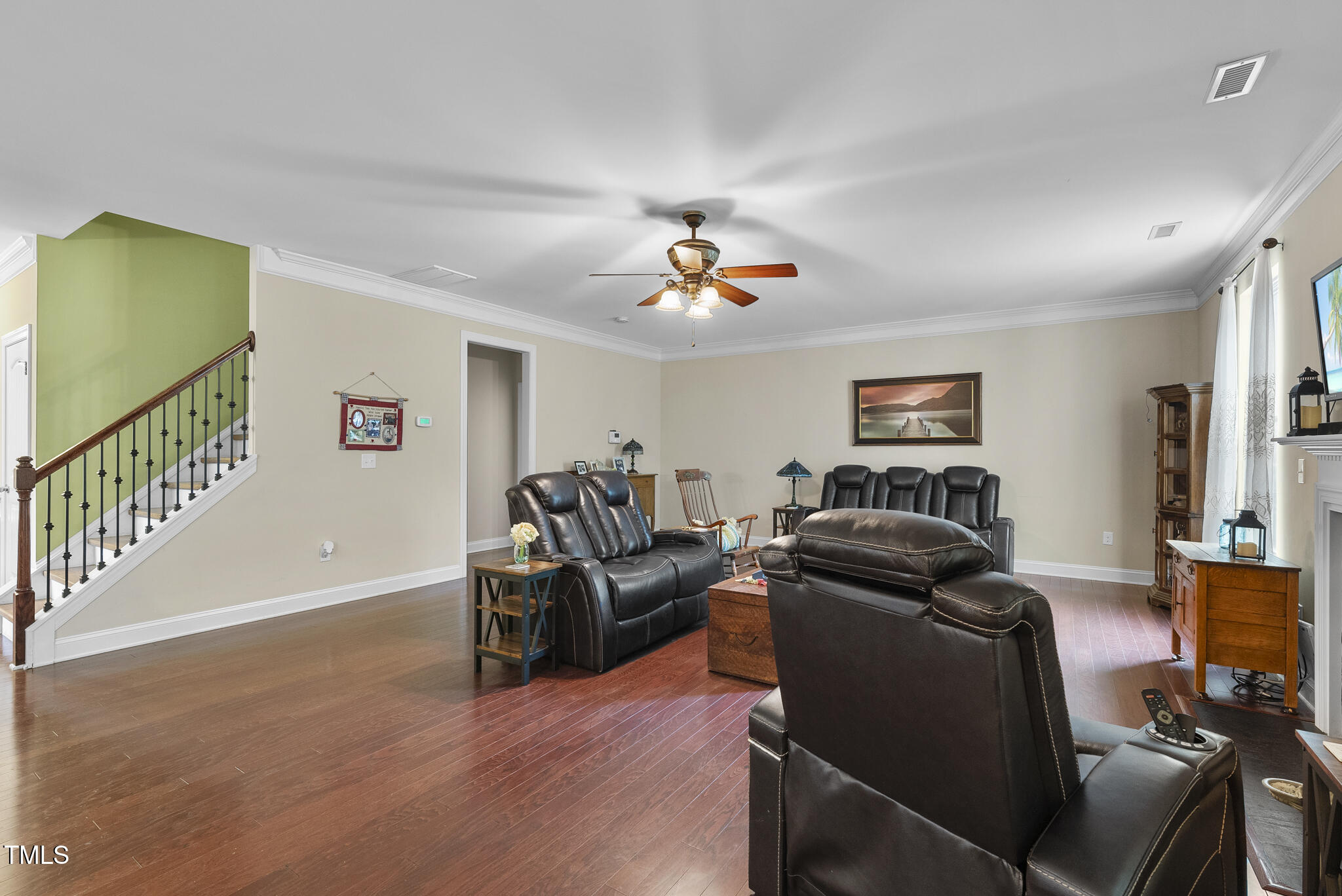 728 Spruce Meadows Lane Willow Spring, NC 27592 - Photo 12 of 45 a living room with furniture and a flat screen tv