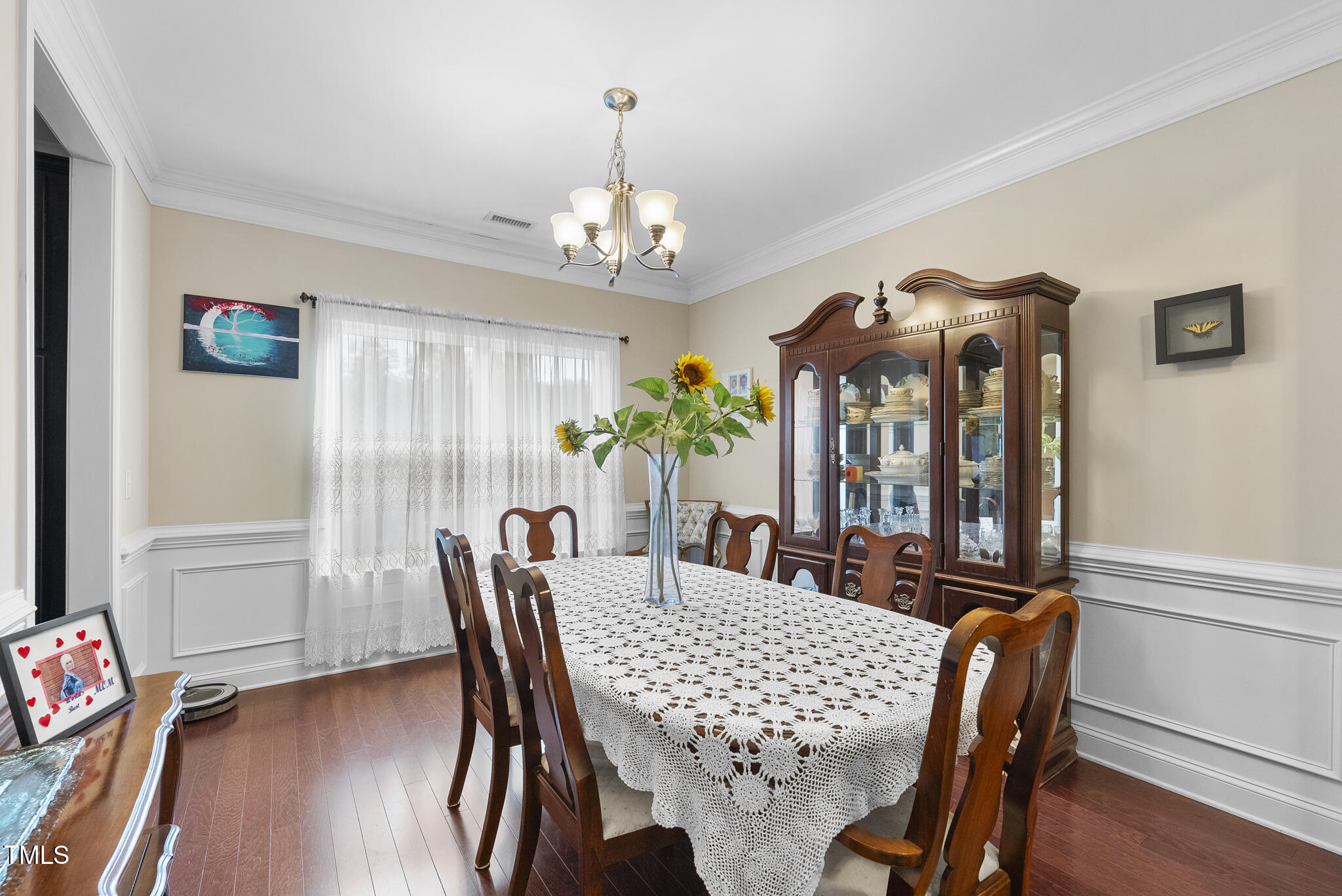 728 Spruce Meadows Lane Willow Spring, NC 27592 - Photo 19 of 45 a view of a dining room with furniture window and wooden floor