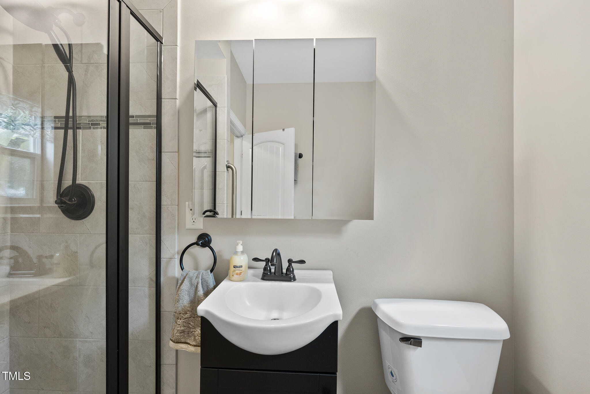 728 Spruce Meadows Lane Willow Spring, NC 27592 - Photo 21 of 45 a bathroom with a sink a toilet and shower