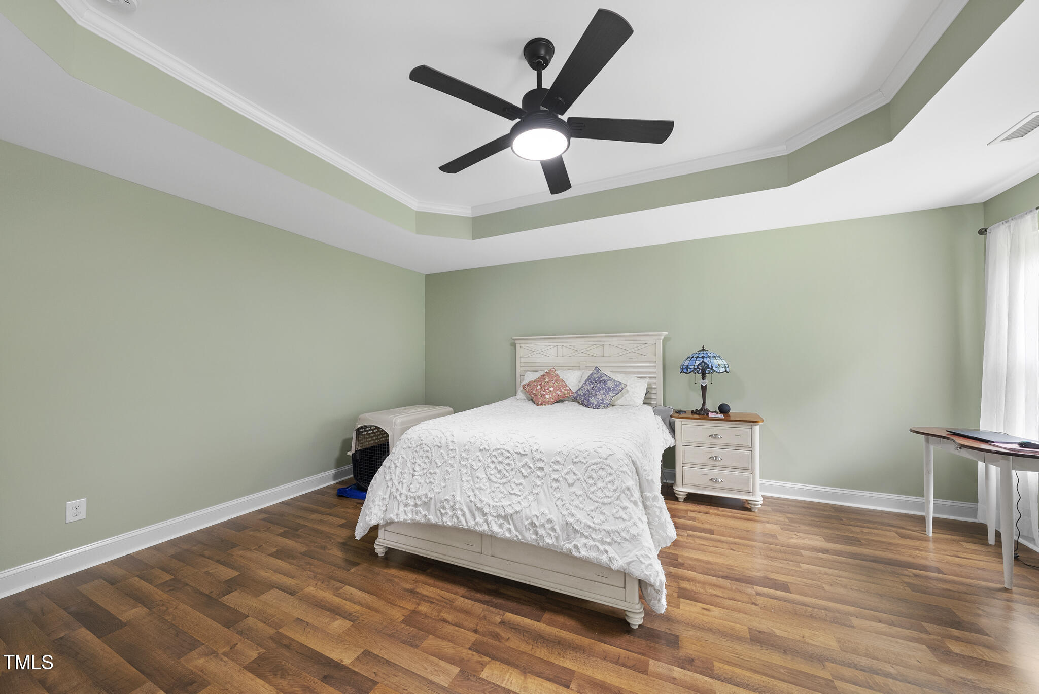 728 Spruce Meadows Lane Willow Spring, NC 27592 - Photo 22 of 45 a bedroom with a bed and wooden floor