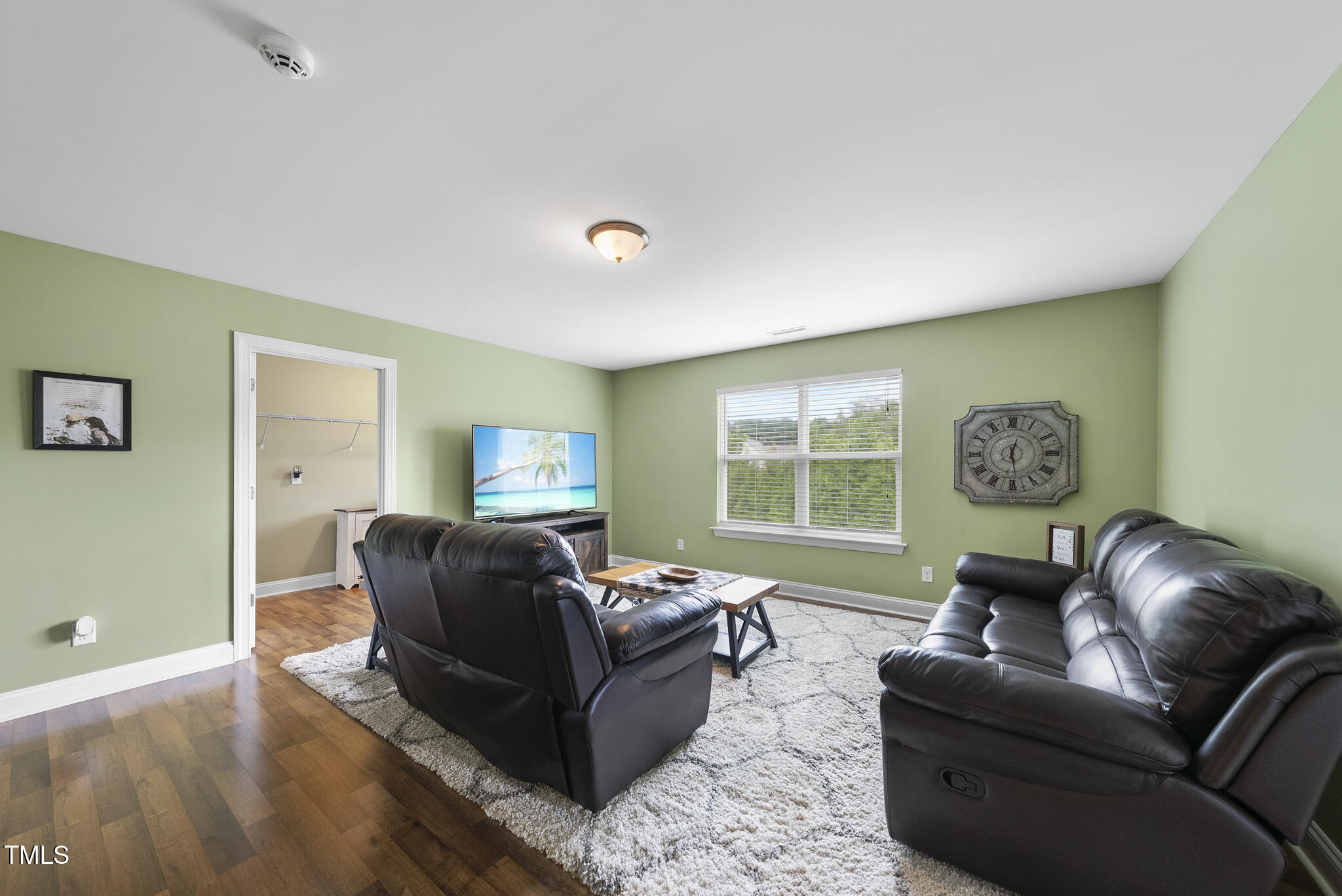 728 Spruce Meadows Lane Willow Spring, NC 27592 - Photo 25 of 45 a living room with furniture window and wooden floor