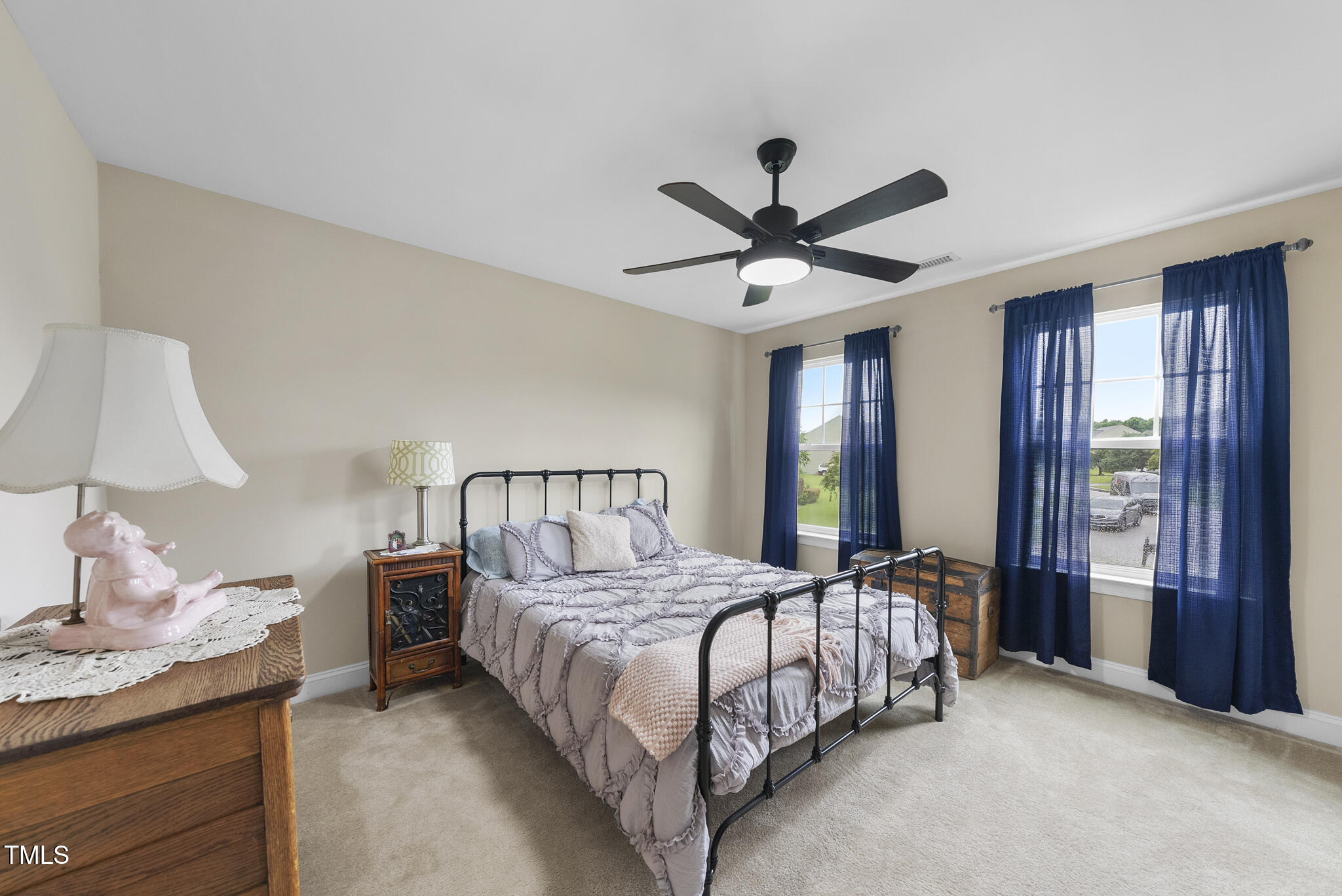 728 Spruce Meadows Lane Willow Spring, NC 27592 - Photo 27 of 45 a bedroom with a large bed and a window