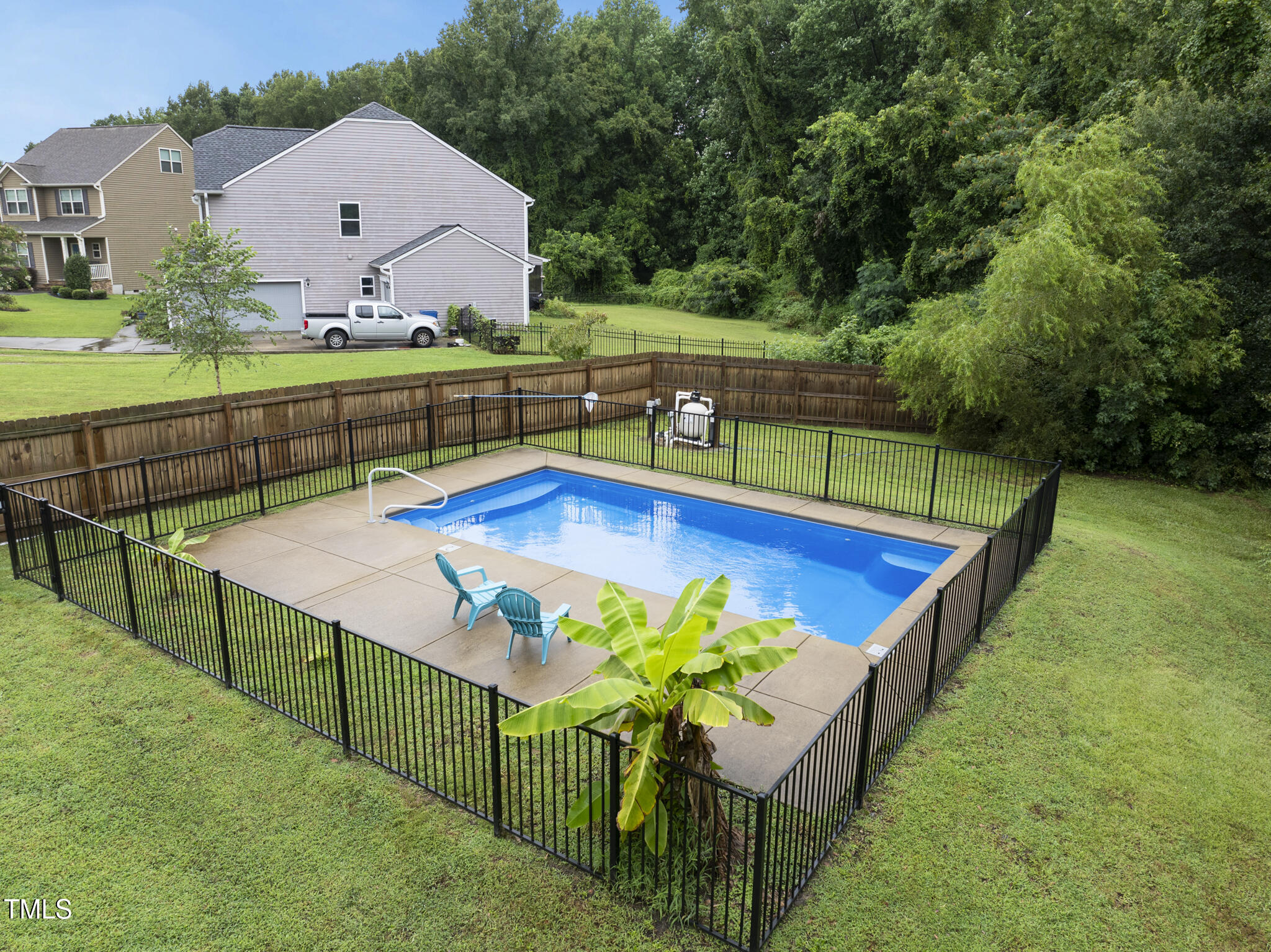 728 Spruce Meadows Lane Willow Spring, NC 27592 - Photo 3 of 45 swimming pool view with a outdoor seating