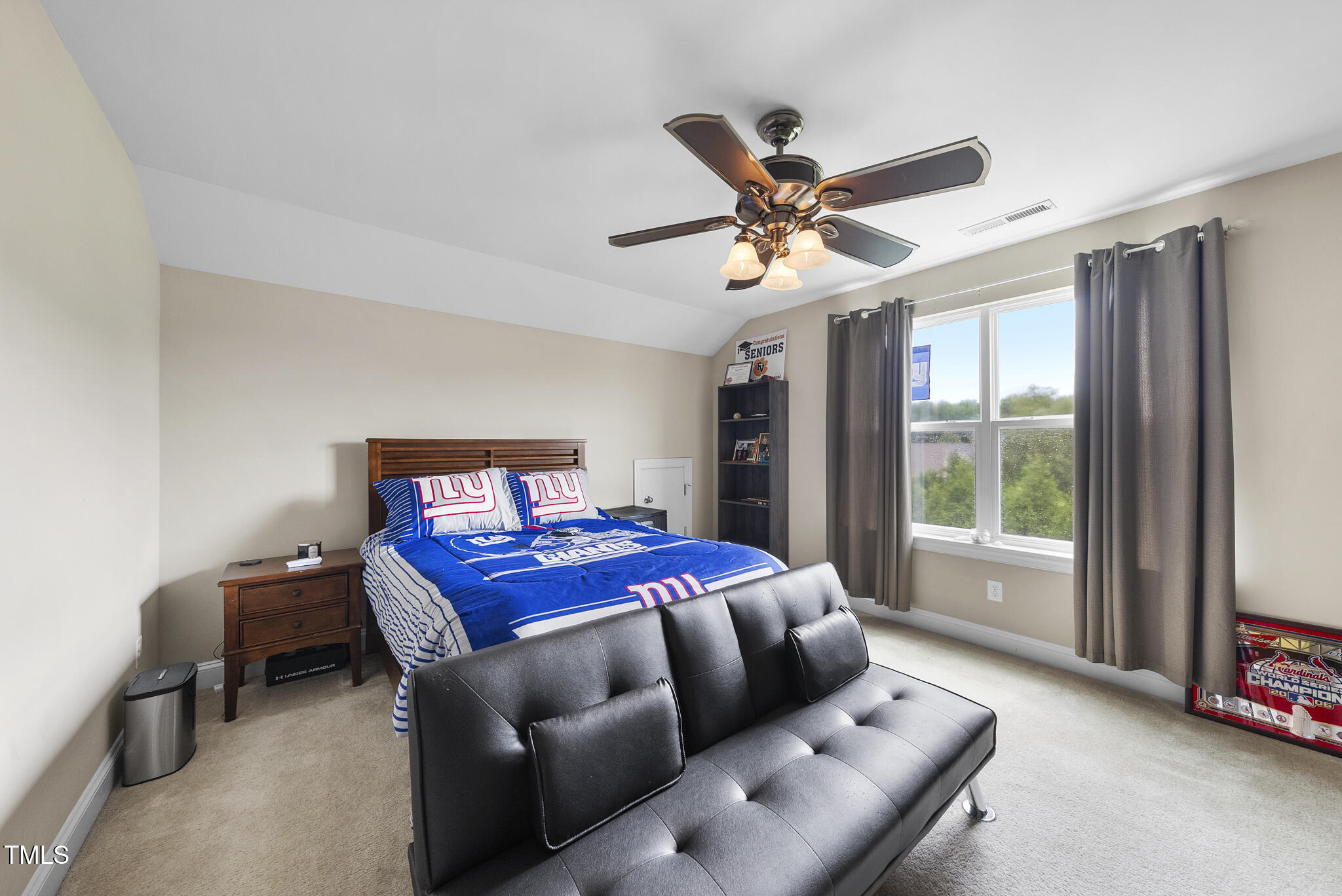 728 Spruce Meadows Lane Willow Spring, NC 27592 - Photo 33 of 45 a bedroom with a bed and a large window