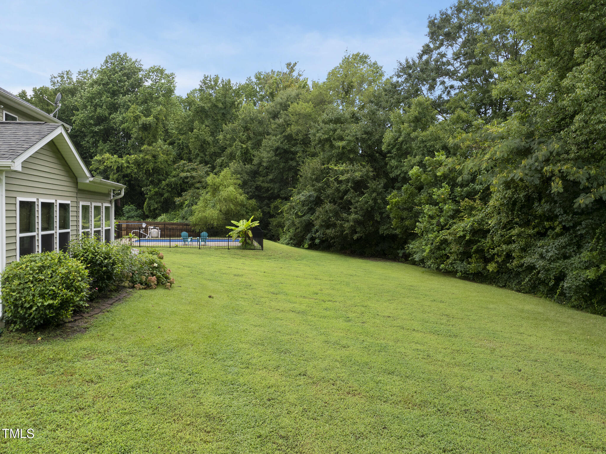 728 Spruce Meadows Lane Willow Spring, NC 27592 - Photo 35 of 45 a view of a house with backyard and garden