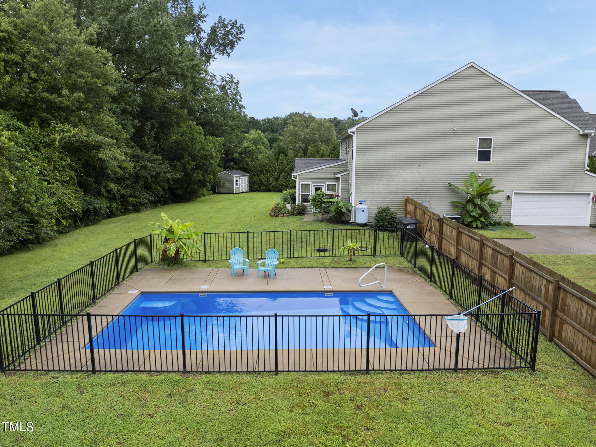 728 Spruce Meadows Lane Willow Spring, NC 27592 - Photo 39 of 45 a view of an house with backyard and pool