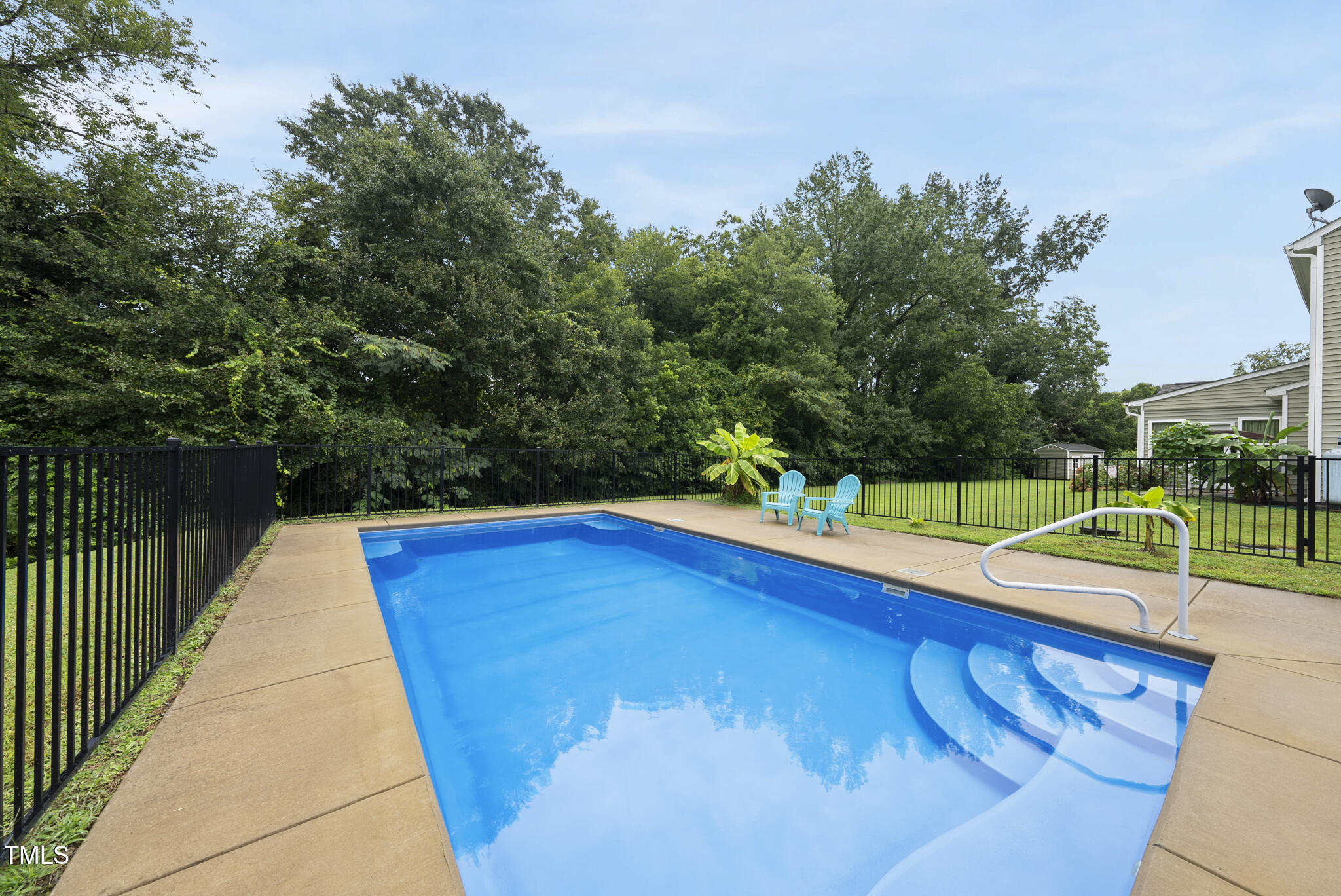 728 Spruce Meadows Lane Willow Spring, NC 27592 - Photo 41 of 45 a view of a swimming pool with a yard