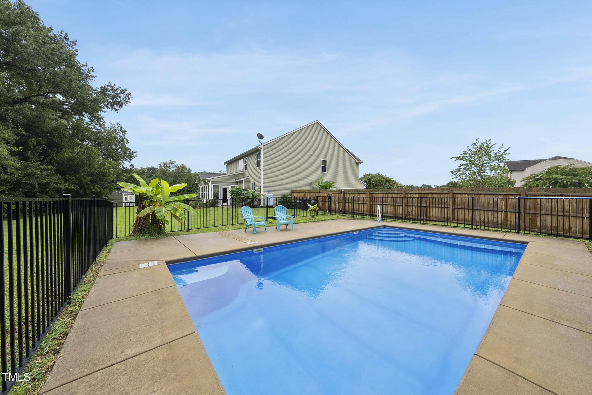 728 Spruce Meadows Lane Willow Spring, NC 27592 - Photo 42 of 45 a view of swimming pool with deck and yard
