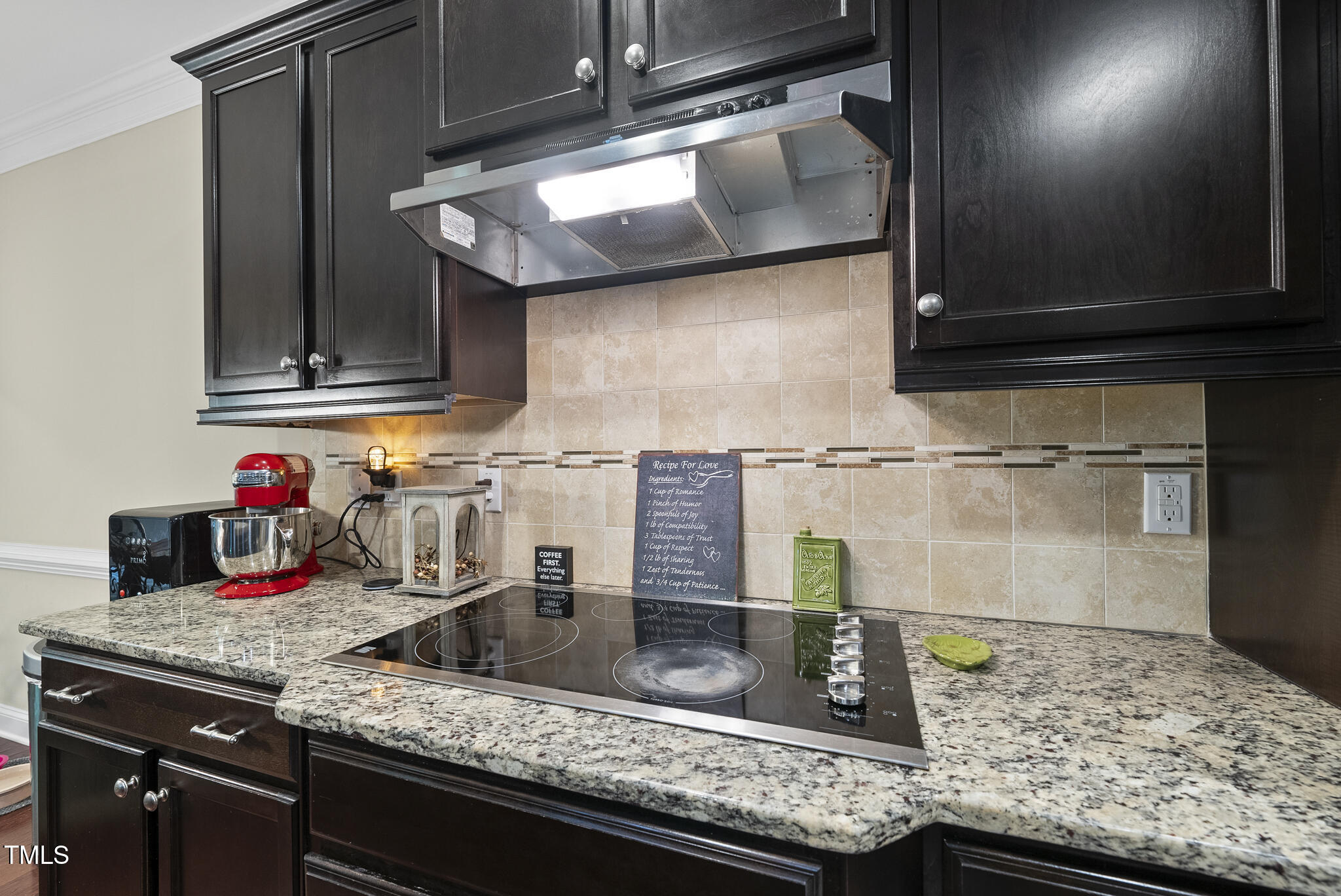728 Spruce Meadows Lane Willow Spring, NC 27592 - Photo 6 of 45 a kitchen with granite countertop a sink and cabinets