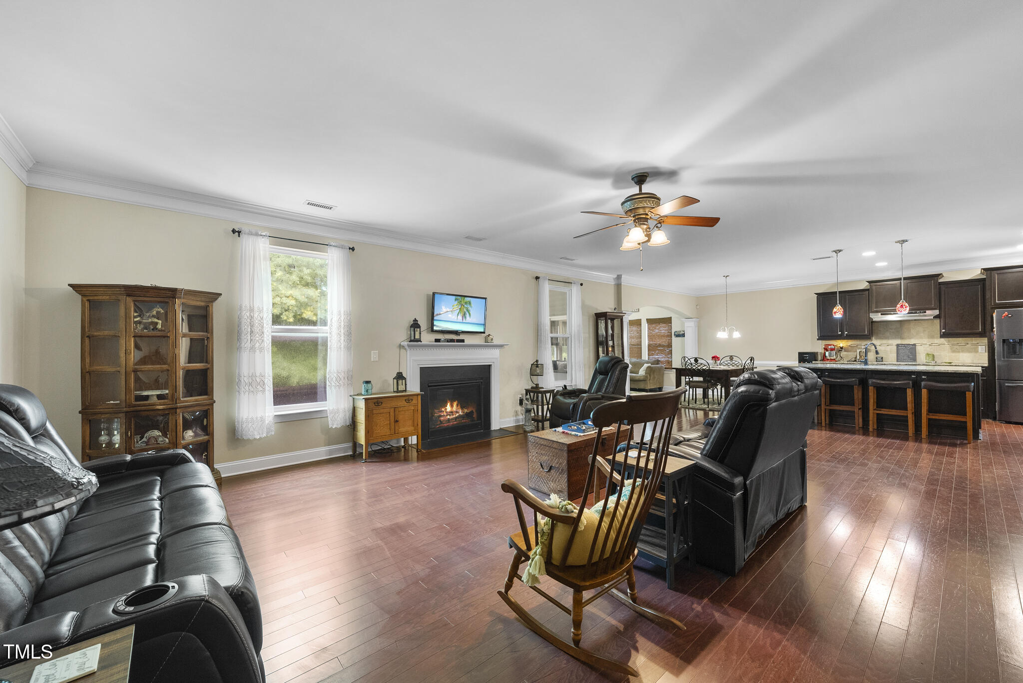 728 Spruce Meadows Lane Willow Spring, NC 27592 - Photo 10 of 45 a living room with furniture and a fireplace