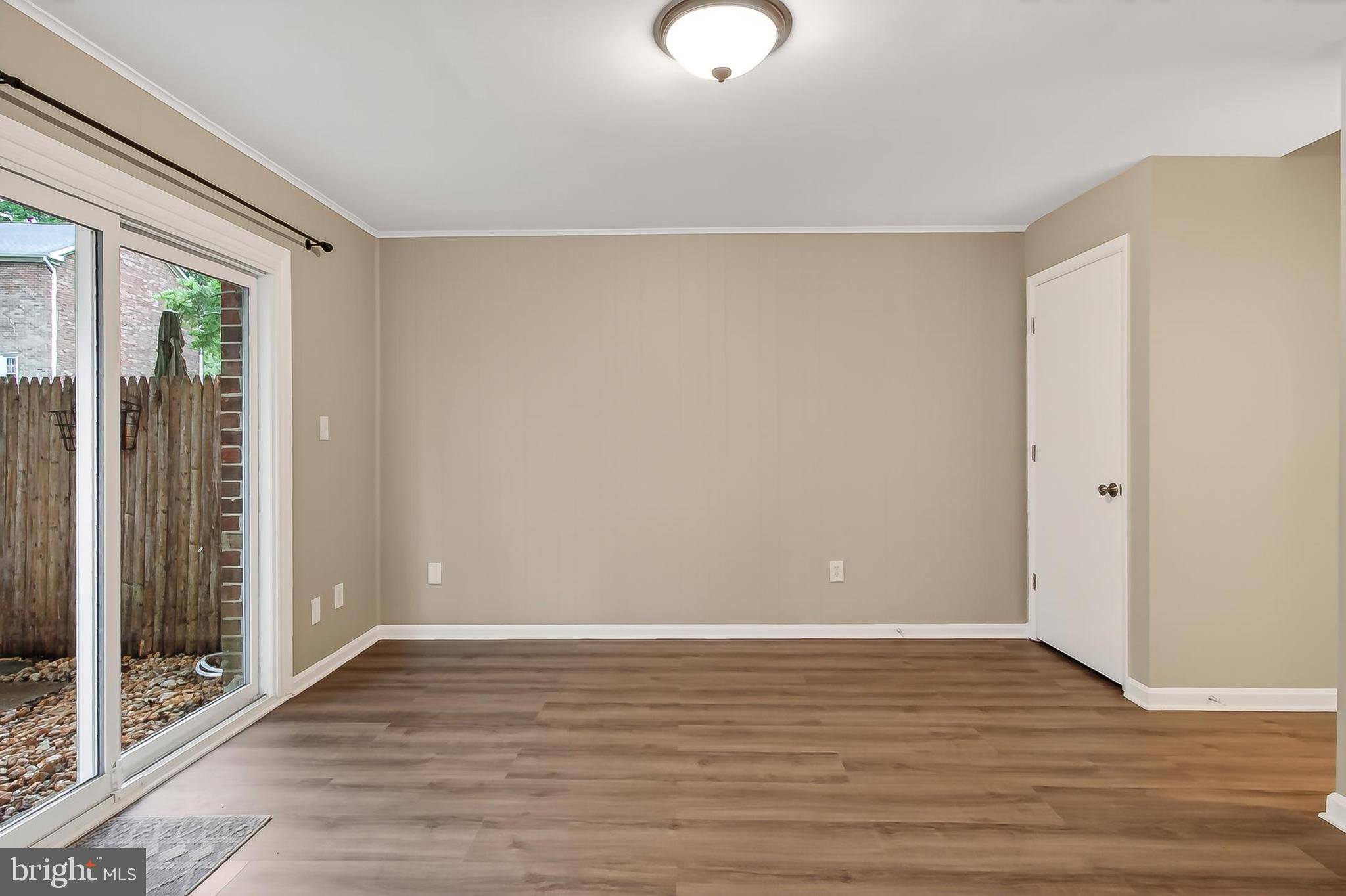 5833 Royal Ridge Drive, Unit 943 Springfield, VA 22152 - Photo 33 of 45 a view of room with window and wooden floor