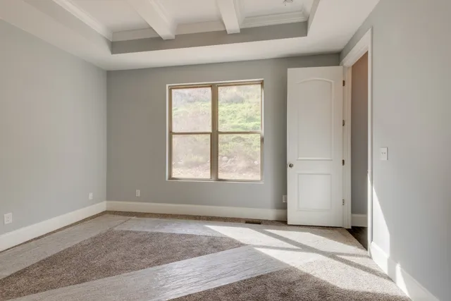 a black white and white photo of a living room
