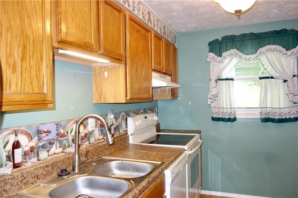 120 Wren Way Washington, PA 15301 - Photo 13 of 30 a kitchen with a sink a stove and a window