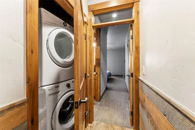 a view of a hallway with washer and dryer