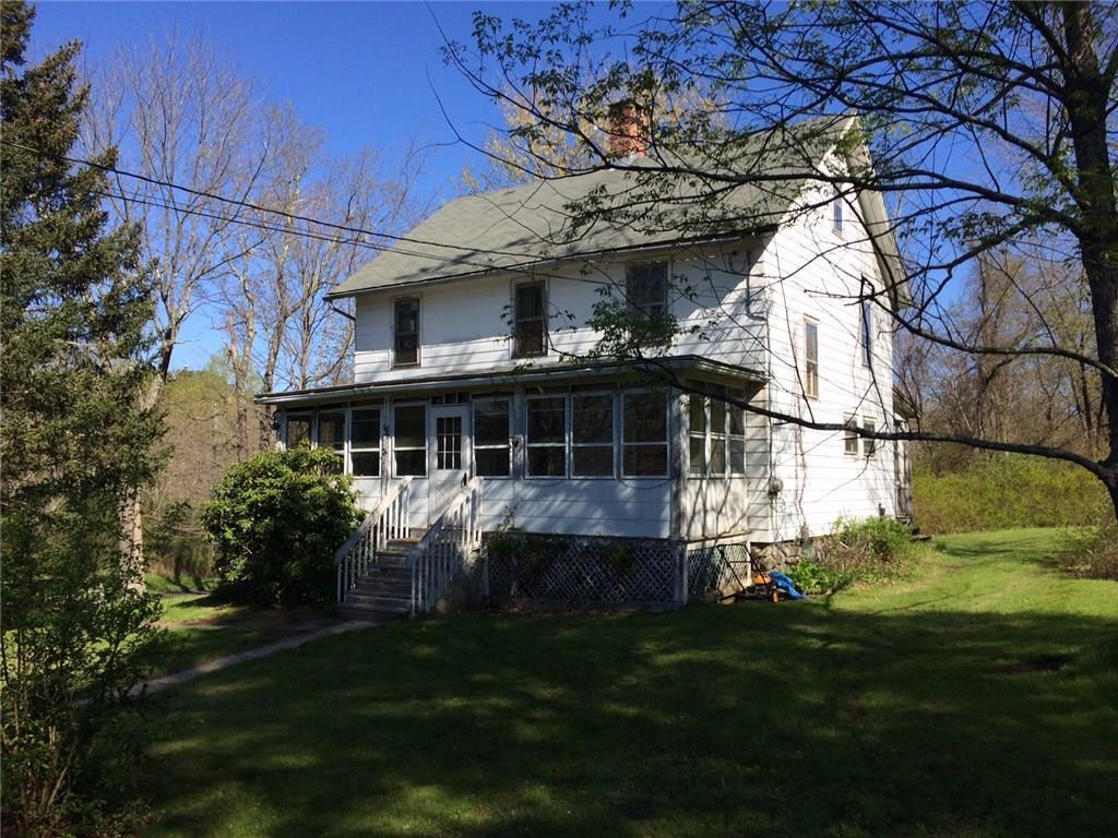 976 Bantam Road Litchfield, CT 06750 - Photo 1 of 1 a front view of a house with a garden