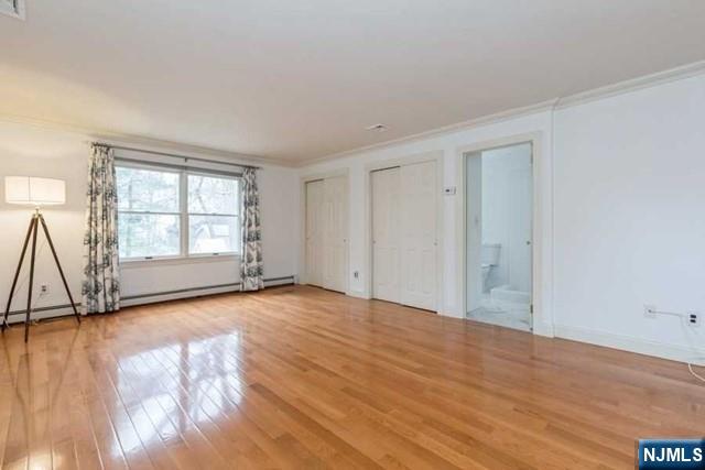 135 7th Street Cresskill, NJ 07626 - Photo 12 of 17 a view of empty room with wooden floor and fan