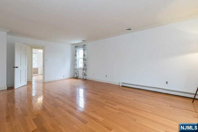 135 7th Street Cresskill, NJ 07626 - Photo 13 of 17 a view of an empty room and wooden floor