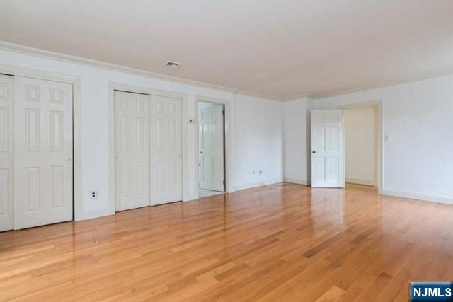 135 7th Street Cresskill, NJ 07626 - Photo 14 of 17 a view of an empty room and wooden floor
