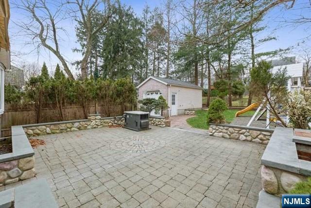 135 7th Street Cresskill, NJ 07626 - Photo 15 of 17 a view of a house with backyard and sitting area