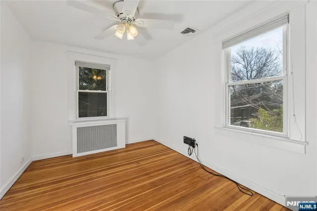 a bedroom with bed and window