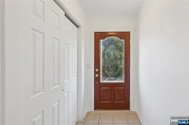 a view of a hallway with a wooden door