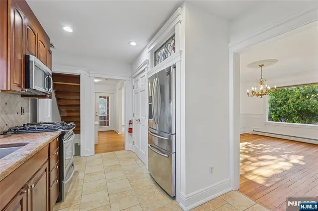 a kitchen with a stove and a refrigerator