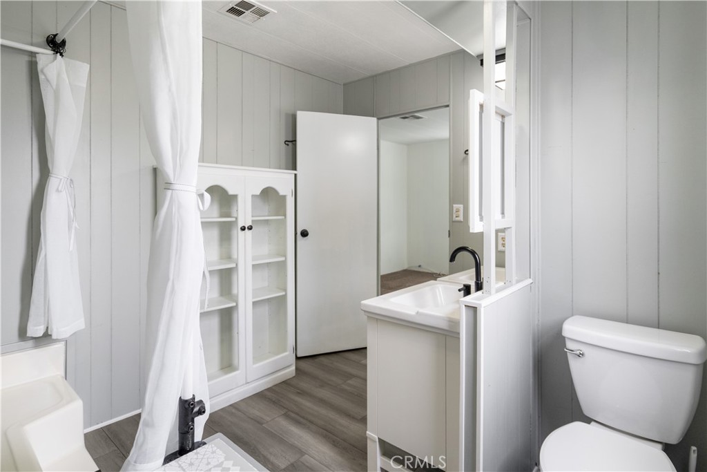 6480 Katherine, Unit 62 Simi Valley, CA 93063 - Photo 16 of 22 a bathroom with a sink toilet and shower