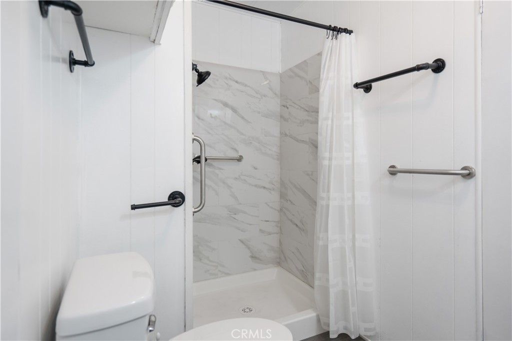 6480 Katherine, Unit 62 Simi Valley, CA 93063 - Photo 19 of 22 a bathroom with a shower and toilet