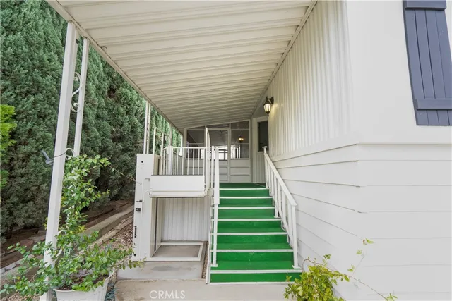 a view of a house with entryway and stairs