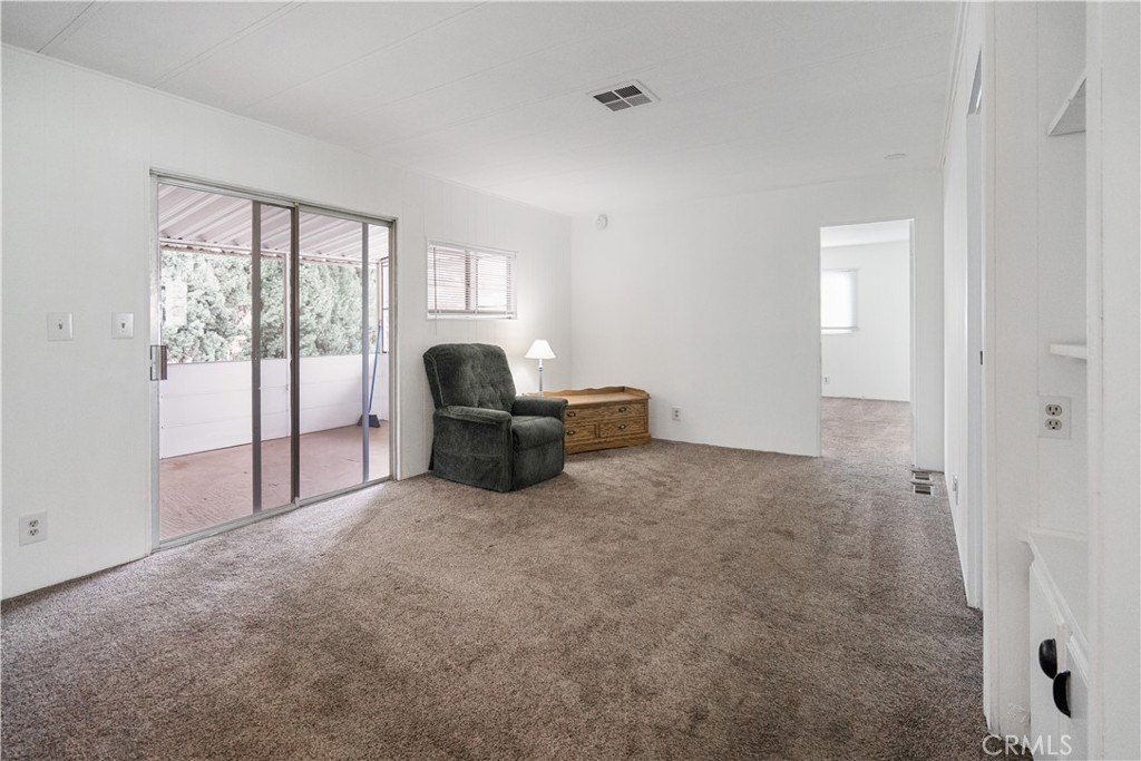 6480 Katherine, Unit 62 Simi Valley, CA 93063 - Photo 10 of 22 a living room with furniture and a large window
