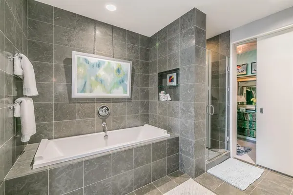 a bathroom with a granite countertop toilet a sink and a mirror