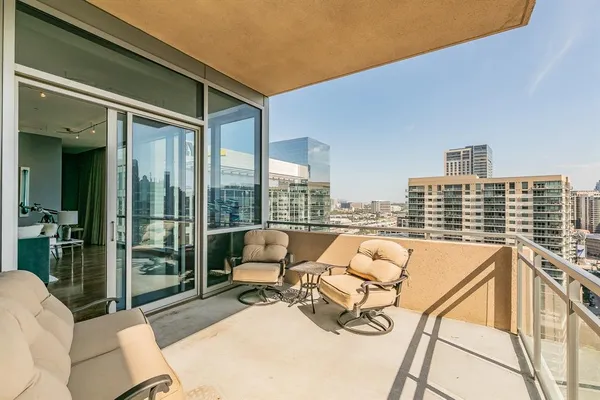 a view of a balcony with furniture