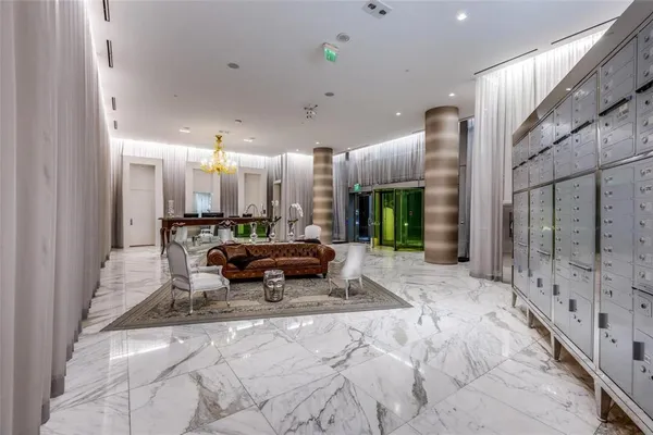 a lobby with furniture and window