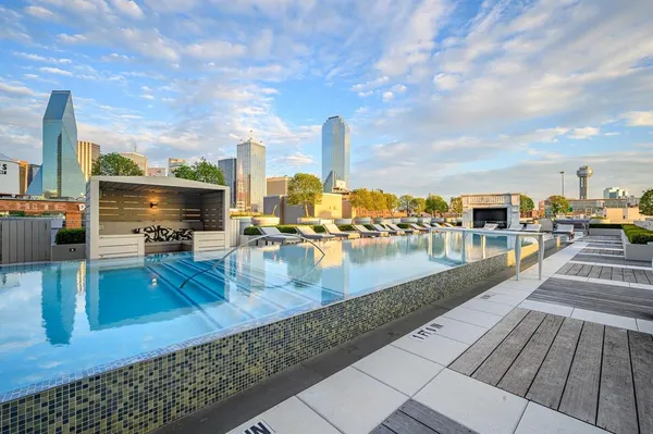 a view of a swimming pool with seating area