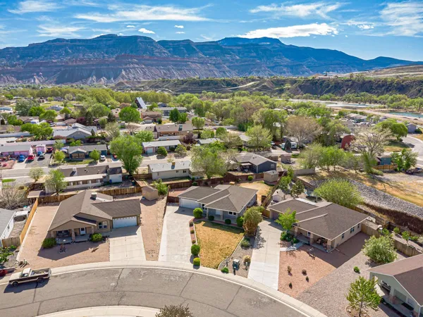 an aerial view of residential houses with outdoor space