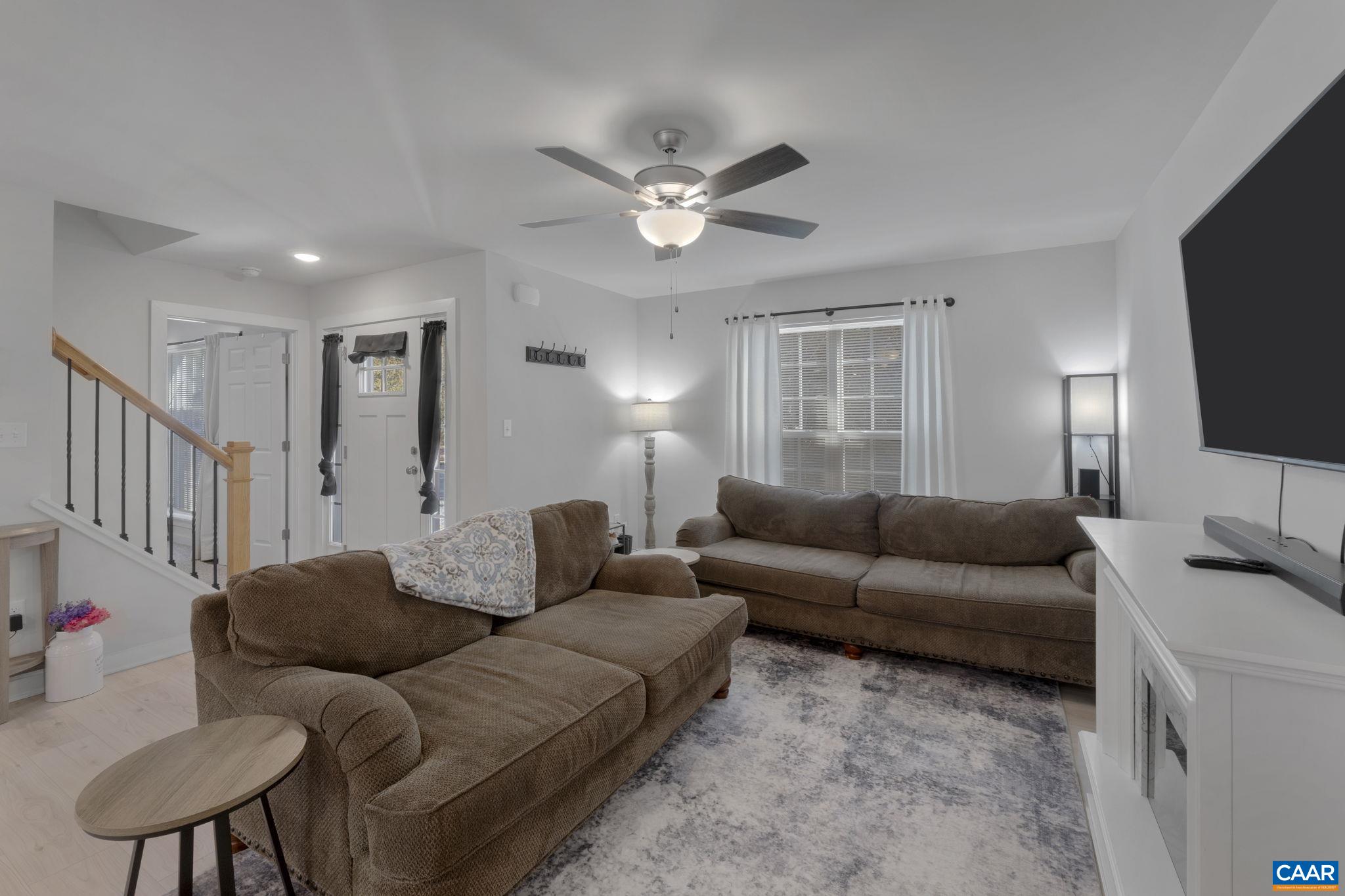 7440 Louisa Road Gordonsville, VA 22942 - Photo 11 of 40 a living room with furniture and a flat screen tv
