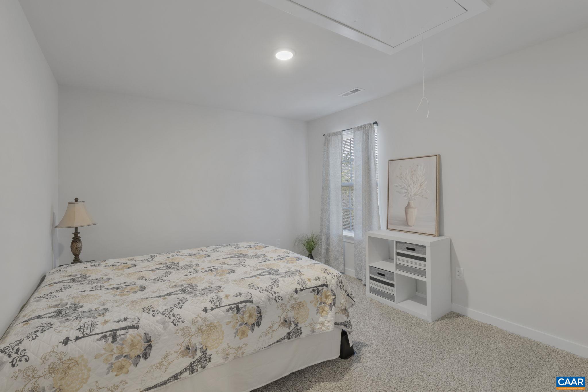 7440 Louisa Road Gordonsville, VA 22942 - Photo 27 of 40 a bedroom with a bed and a view of bathroom