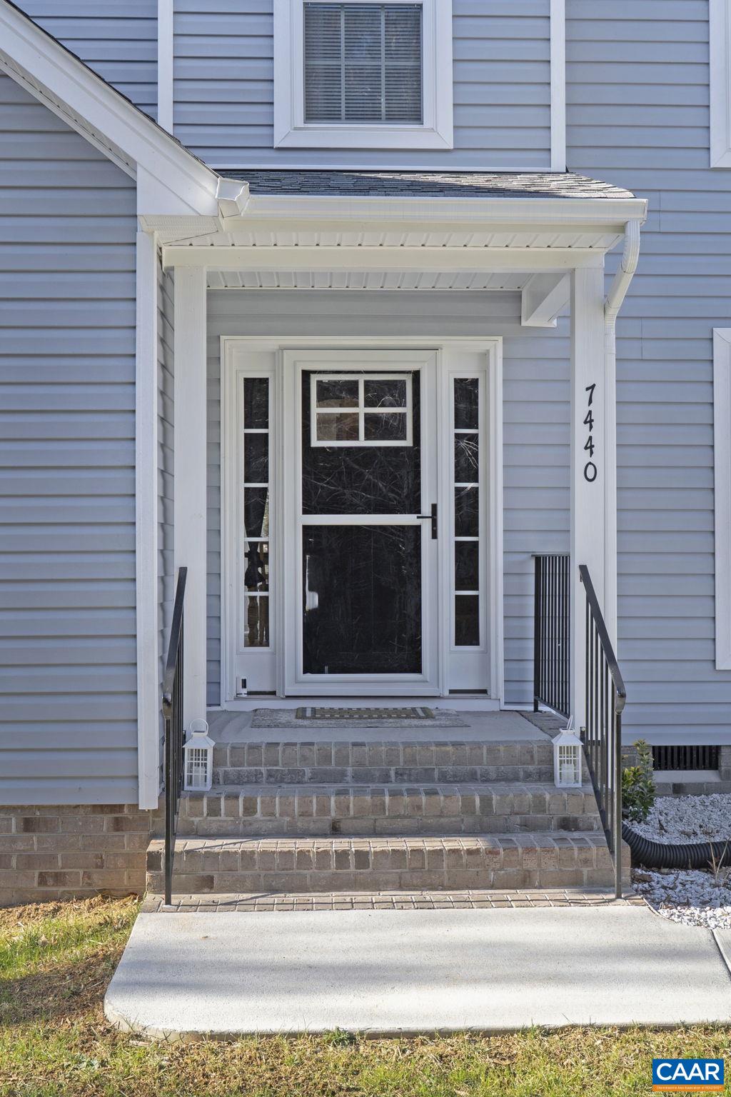 7440 Louisa Road Gordonsville, VA 22942 - Photo 5 of 40 a front view of a house with a rug