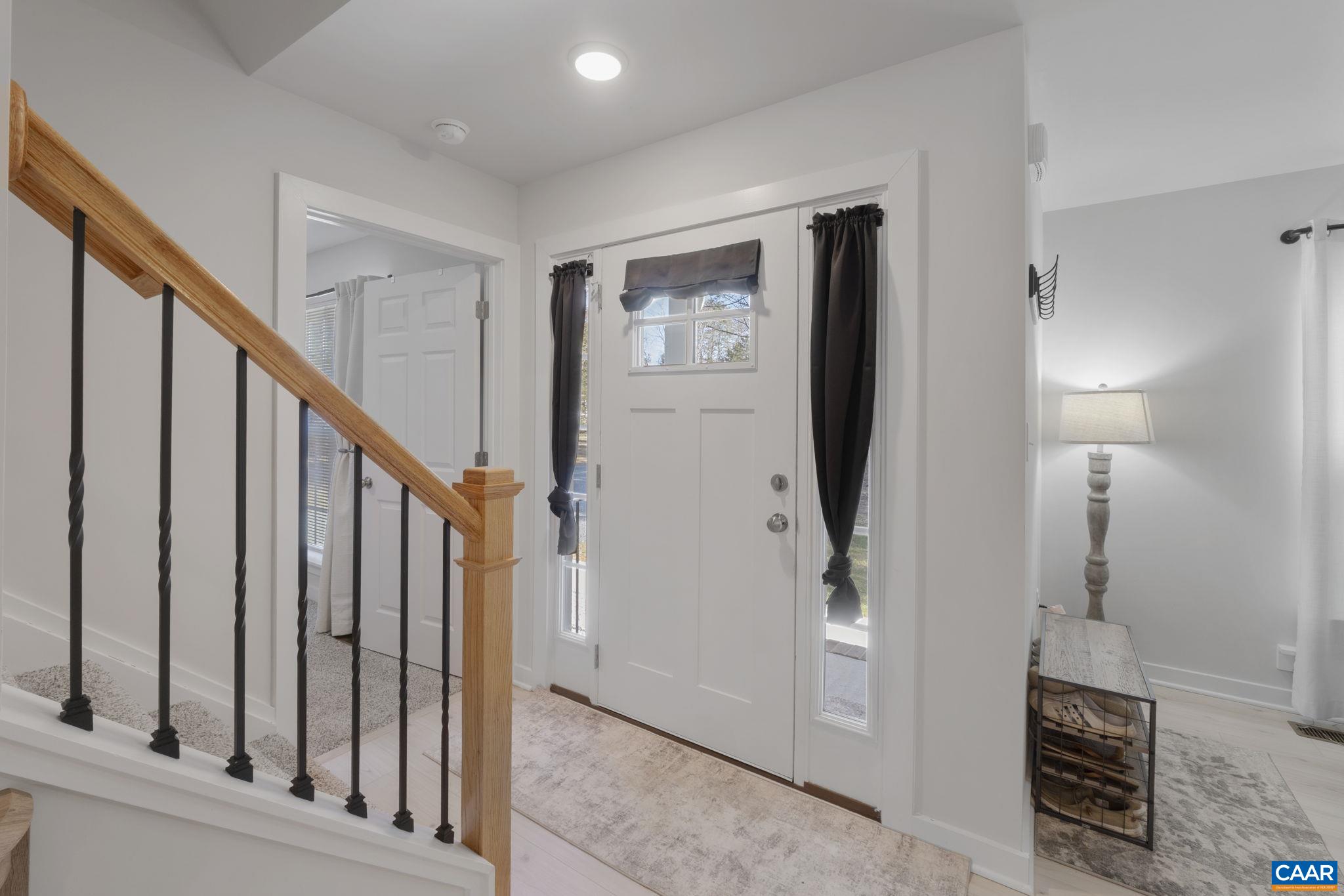7440 Louisa Road Gordonsville, VA 22942 - Photo 6 of 40 a view of hallway with stairs and wooden floor
