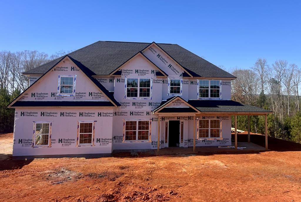 a front view of a house with yard
