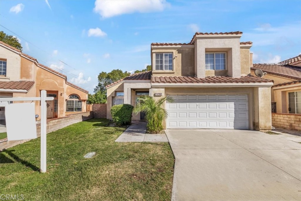11423 Plane Tree Road Fontana, CA 92337 - Photo 1 of 1 a front view of a house with a yard and garage
