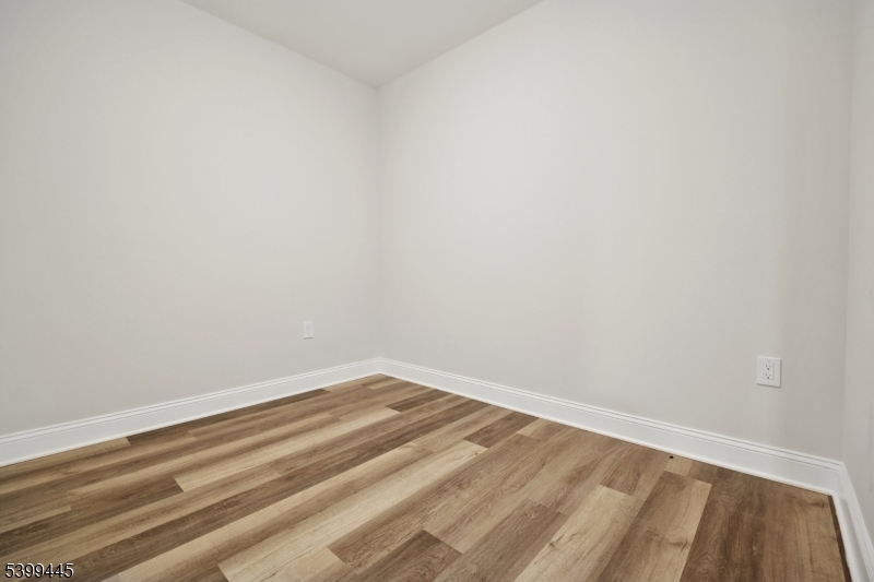 246 Main Street, Unit 304 Chatham, NJ 07928 - Photo 11 of 31 a view of a room with wooden floor