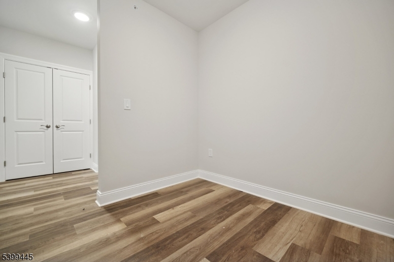 246 Main Street, Unit 304 Chatham, NJ 07928 - Photo 12 of 31 a view of a room with wooden floor