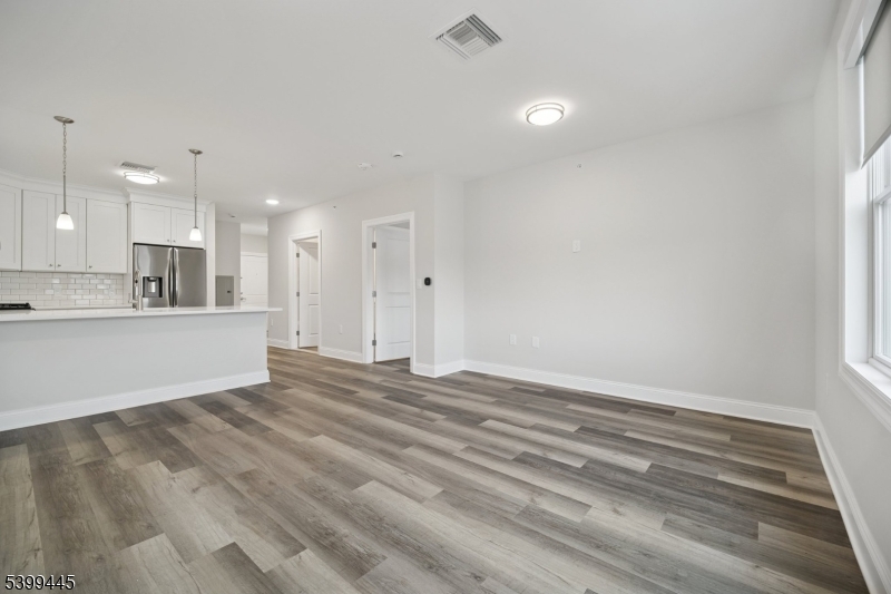 246 Main Street, Unit 304 Chatham, NJ 07928 - Photo 9 of 31 a view of kitchen and kitchen with wooden floor