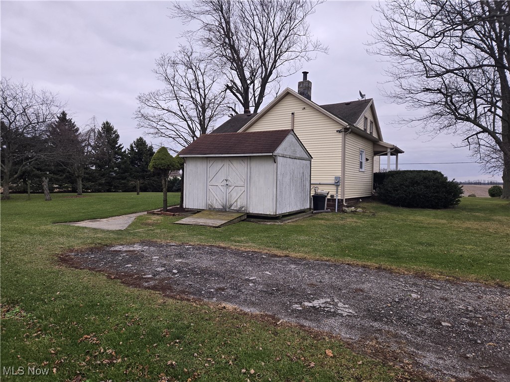 1962 Zenobia Road Norwalk, OH 44857 - Photo 25 of 30 View of outbuilding with cooling unit and a yard