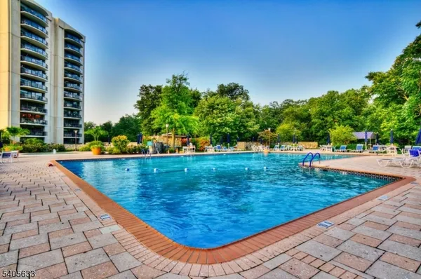 a view of a swimming pool with a yard