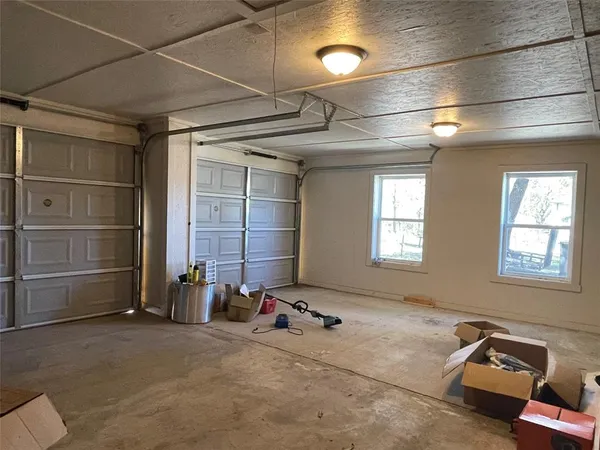 a room with gym equipment and a window